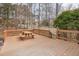 The deck is equipped with a picnic table, wooden floorboards, and railing around the perimeter at 5806 Whispering Meadow Ln, Durham, NC 27712