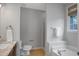 Bathroom featuring a double sink vanity with marble countertop, shower, and a soaking tub at 5806 Whispering Meadow Ln, Durham, NC 27712