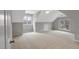 Carpeted bedroom features a vaulted ceiling, neutral colors, and lots of light from two windows at 5806 Whispering Meadow Ln, Durham, NC 27712