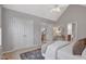 This bedroom features neutral walls, white trim, and a glimpse of the stairs and bathroom at 5806 Whispering Meadow Ln, Durham, NC 27712