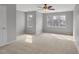 Bright, neutral bedroom features natural light from two windows, and a ceiling fan at 5806 Whispering Meadow Ln, Durham, NC 27712
