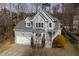 Charming two-story home with a well-manicured lawn and mature trees, perfect for Gathering living at 5806 Whispering Meadow Ln, Durham, NC 27712