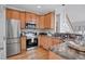 Well-equipped kitchen with stainless steel appliances, granite countertops, and ample cabinet space at 5806 Whispering Meadow Ln, Durham, NC 27712