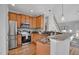 Spacious kitchen with granite countertops, stainless steel appliances, and hardwood floors, perfect for cooking and entertaining at 5806 Whispering Meadow Ln, Durham, NC 27712