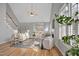 Bright living room features vaulted ceilings, hardwood floors, fireplace, and sliding doors leading to deck at 5806 Whispering Meadow Ln, Durham, NC 27712