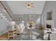 Bright living room features vaulted ceilings, hardwood floors, fireplace, and sliding doors leading to deck at 5806 Whispering Meadow Ln, Durham, NC 27712