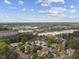 Aerial view of a residential neighborhood with tree-lined streets under a blue sky at 5945 Four Townes Ln, Raleigh, NC 27616
