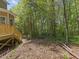 Lush backyard with mature trees, providing ample privacy and shade at 5945 Four Townes Ln, Raleigh, NC 27616
