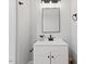 Modern bathroom with a sleek vanity, square mirror, and updated fixtures at 5945 Four Townes Ln, Raleigh, NC 27616