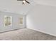 Bright bedroom features neutral carpeting and light walls, creating a serene atmosphere at 5945 Four Townes Ln, Raleigh, NC 27616