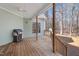 Back deck with a grill, and wooden railing overlooking a wooded area at 613 Hamecon Place, Cedar Grove, NC 27231