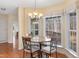Breakfast nook with wood floors and light-filled windows overlooking wooded area at 613 Hamecon Place, Cedar Grove, NC 27231