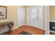 Foyer featuring wood floors, decorative console table, closet, and decorative front door at 613 Hamecon Place, Cedar Grove, NC 27231