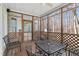 Comfortable screened porch with lattice railing and outdoor furniture at 613 Hamecon Place, Cedar Grove, NC 27231