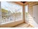 Cozy balcony with wood floors and white railings offers a view of the surrounding area at 622 Ives Ct # 622, Chapel Hill, NC 27514