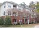 Attractive condominium complex with brick facade, neutral siding and well-maintained landscaping at 622 Ives Ct # 622, Chapel Hill, NC 27514