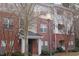 Exterior view of the condo showing the brick facade and private balcony on the upper floor at 622 Ives Ct # 622, Chapel Hill, NC 27514