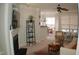 Bright living room with fireplace, TV, shelving unit, and open view to the dining area at 622 Ives Ct # 622, Chapel Hill, NC 27514