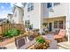 Spacious deck with a dining set, garden beds, and fenced yard, ideal for outdoor living at 622 Village Lake Drive, Mebane, NC 27302