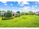 Lush, expansive backyard featuring a well-manicured lawn and charming architectural details at 622 Village Lake Drive, Mebane, NC 27302