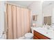 Clean bathroom with a shower and tub combination, a sink, and neutral-toned walls at 622 Village Lake Drive, Mebane, NC 27302