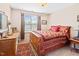 Bedroom featuring a wooden bed frame, and a window with natural lighting at 622 Village Lake Drive, Mebane, NC 27302