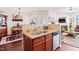 Open kitchen with stainless steel sink, granite countertops, and view into dining and living areas at 622 Village Lake Drive, Mebane, NC 27302