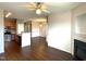 Open-concept living space with hardwood floors, fireplace, kitchen, and great natural lighting at 622 Village Lake Drive, Mebane, NC 27302