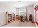 Bright office space with built-in shelves, a desk, and a window offering natural light at 622 Village Lake Drive, Mebane, NC 27302