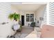 Cozy covered patio with seating, a grill, and a welcoming atmosphere at 622 Village Lake Drive, Mebane, NC 27302