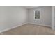 Bedroom with carpet and window with a view at 703 Vance St, Henderson, NC 27536
