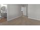 An open doorway reveals neutral carpet, fresh paint, and a bathroom at 703 Vance St, Henderson, NC 27536