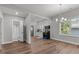 Open dining area with an elegant chandelier, natural light, and easy access to the kitchen at 703 Vance St, Henderson, NC 27536