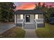 Charming one-story home with a welcoming front porch and newly renovated stairs at 703 Vance St, Henderson, NC 27536