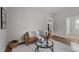 Cozy living area showcasing a modern brown sofa, a round glass table, and new flooring at 703 Vance St, Henderson, NC 27536