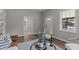 Bright living room featuring wood floors, neutral walls, and stylish modern decor at 703 Vance St, Henderson, NC 27536