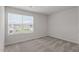 A cozy bedroom bathed in natural light, boasting plush carpeting and neutral walls at 704 Rhino Bnd, Oxford, NC 27565