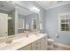 Bathroom features a double sink vanity and a large mirror at 7100 Winter Pond Way, Fuquay Varina, NC 27526