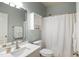 Bathroom featuring a white vanity and a shower with a curtain at 7100 Winter Pond Way, Fuquay Varina, NC 27526