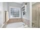 Bright bathroom with a soaking tub and glass shower at 7100 Winter Pond Way, Fuquay Varina, NC 27526