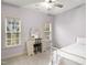 Bedroom with desk and chair, bright natural light, and carpet at 7100 Winter Pond Way, Fuquay Varina, NC 27526