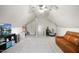 A finished bonus room features neutral carpet, vaulted ceilings and an abundance of natural light at 7100 Winter Pond Way, Fuquay Varina, NC 27526