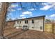 Rear view of the home featuring a newly installed fence and a nice-sized, level yard at 838 Waring St, Durham, NC 27704