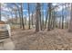 Spacious backyard with partial fencing and mature trees at 838 Waring St, Durham, NC 27704