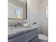 Bathroom featuring granite countertops, modern fixtures, with a view from the window at 838 Waring St, Durham, NC 27704