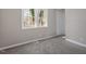 Bedroom with neutral carpet and a window at 838 Waring St, Durham, NC 27704