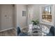 Bright dining area with a glass table and views from the large window at 838 Waring St, Durham, NC 27704