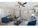 Cozy living room featuring a ceiling fan and gray walls at 838 Waring St, Durham, NC 27704