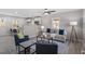 Open concept living room with modern decor and a ceiling fan at 838 Waring St, Durham, NC 27704