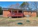 Expansive backyard featuring a covered deck and a well-maintained lawn at 8604 N Roxboro St, Bahama, NC 27503